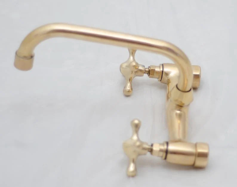 Antique Brass Bridge Faucet - A stunning, vintage-inspired kitchen faucet in an antique brass finish. This bridge faucet combines classic elegance and timeless charm. The faucet features a bridge design with two handles and a swivel spout, providing convenience and flexibility in your kitchen. The solid brass construction ensures durability and longevity. Perfect for those who appreciate the allure of old-world romance and want to add a touch of vintage sophistication to their kitchen décor